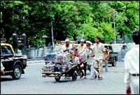 Come rain or shine, the dabbawala service does not stop. The doughty little men deliver on time.